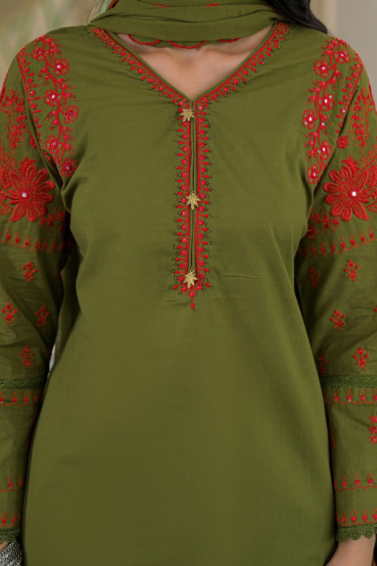 An olive green long-sleeve kurta with red floral embroidery and gold decorative accents on the neckline and sleeves, shown on a model.